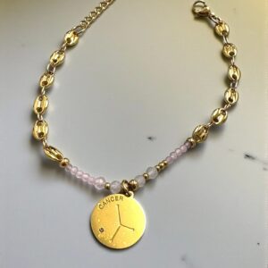 Pulsera Càncer en Acero Dorado  con las Piedras del Signo