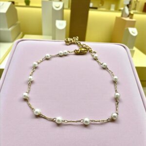Pulsera en Acero Dorado con Perlas