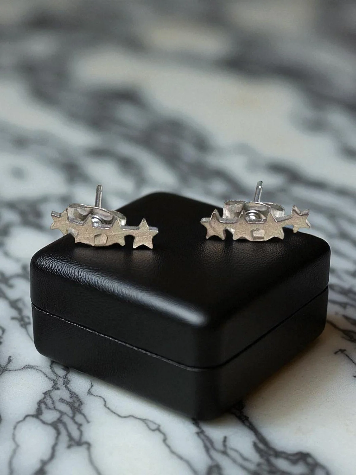 Pendientes en acero plateado 4 estrellas