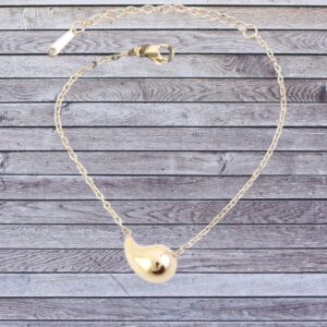 Pulsera adorno forma gota en acero dorado