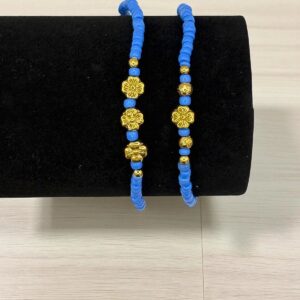 Pulsera piedras azules y flores doradas