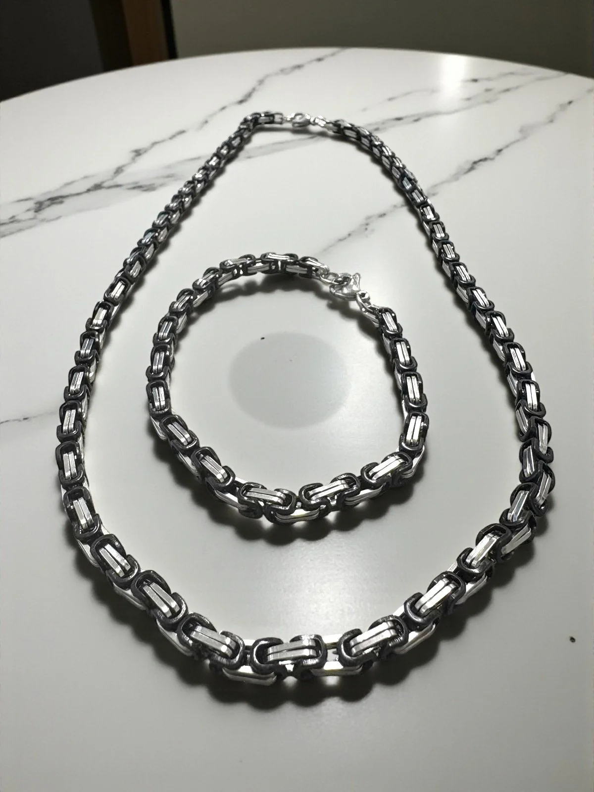 Conjunto Cadena y Pulsera En Acero Plateado y Negro