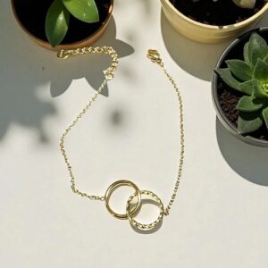 Pulsera en Acero Dorado Anillos Entrelazados