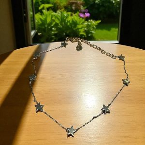 Tobillera estrellas en acero dorado