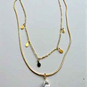 Collar doble en acero dorado con dijes y solitario