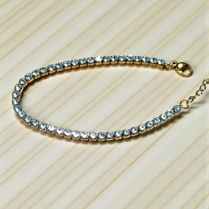 Pulsera tira circonitas blanca en acero dorado